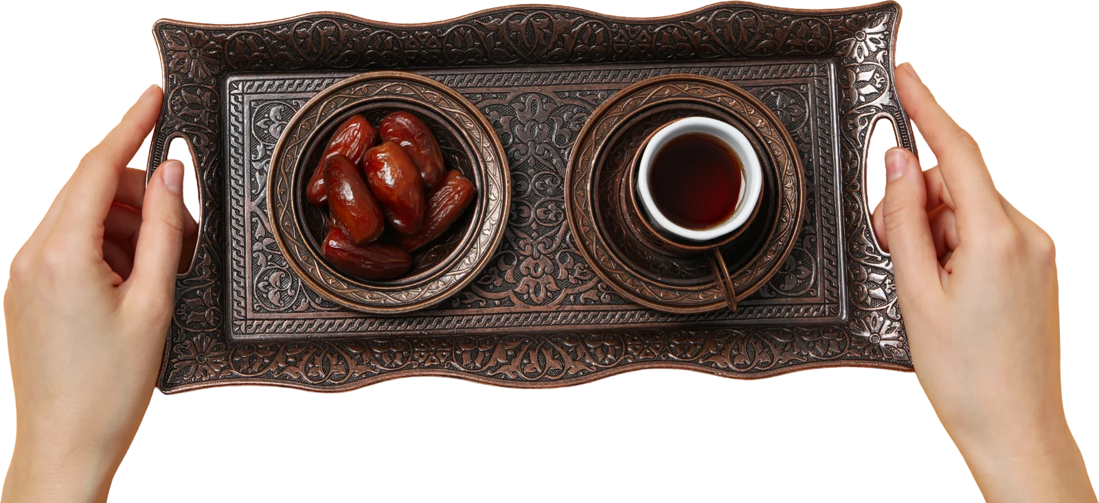 Dates and Arabic coffee served on a traditional tray